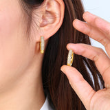 The Pavé Huggie Hoop Earrings